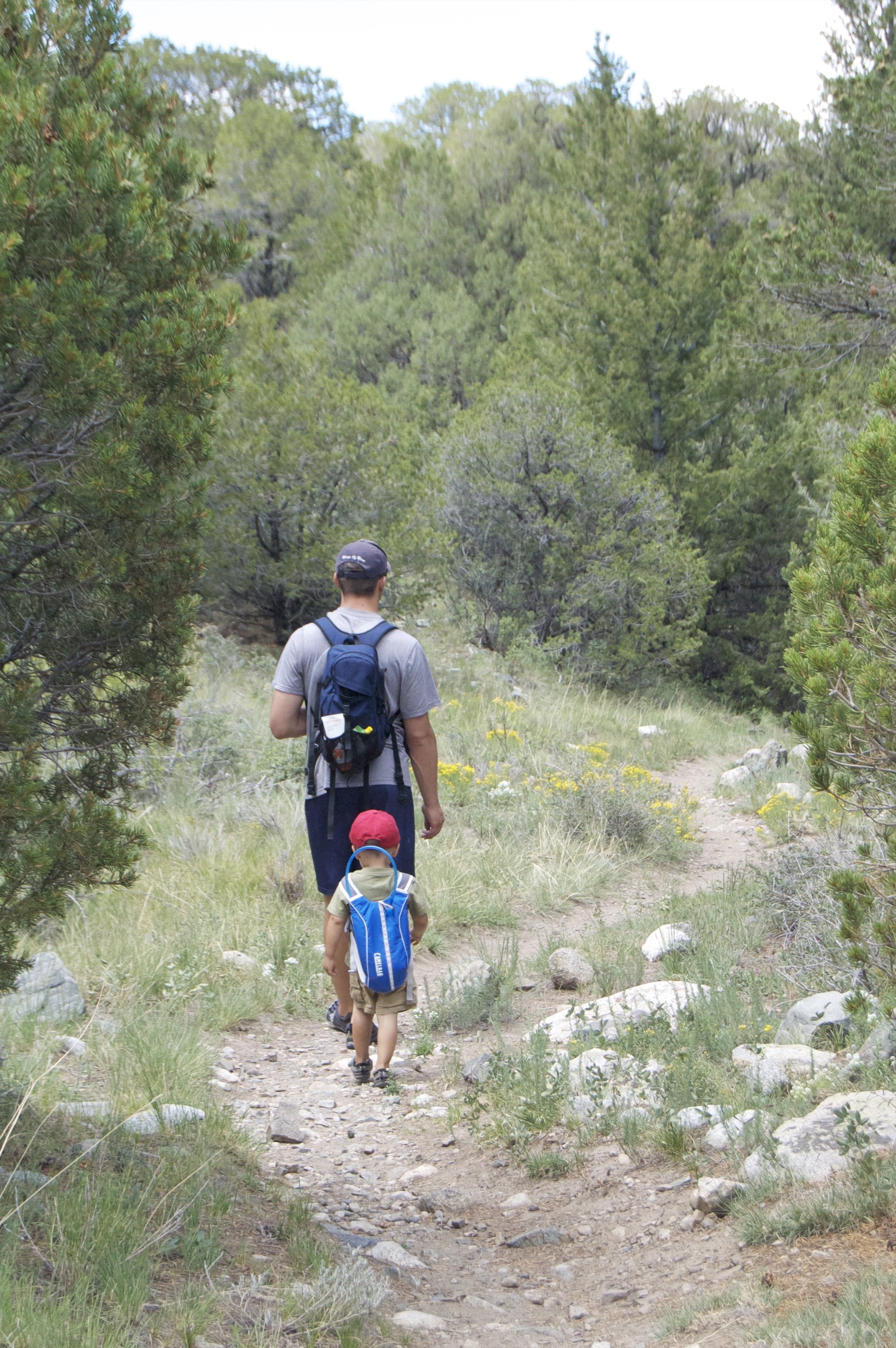 Boy and man on a trail